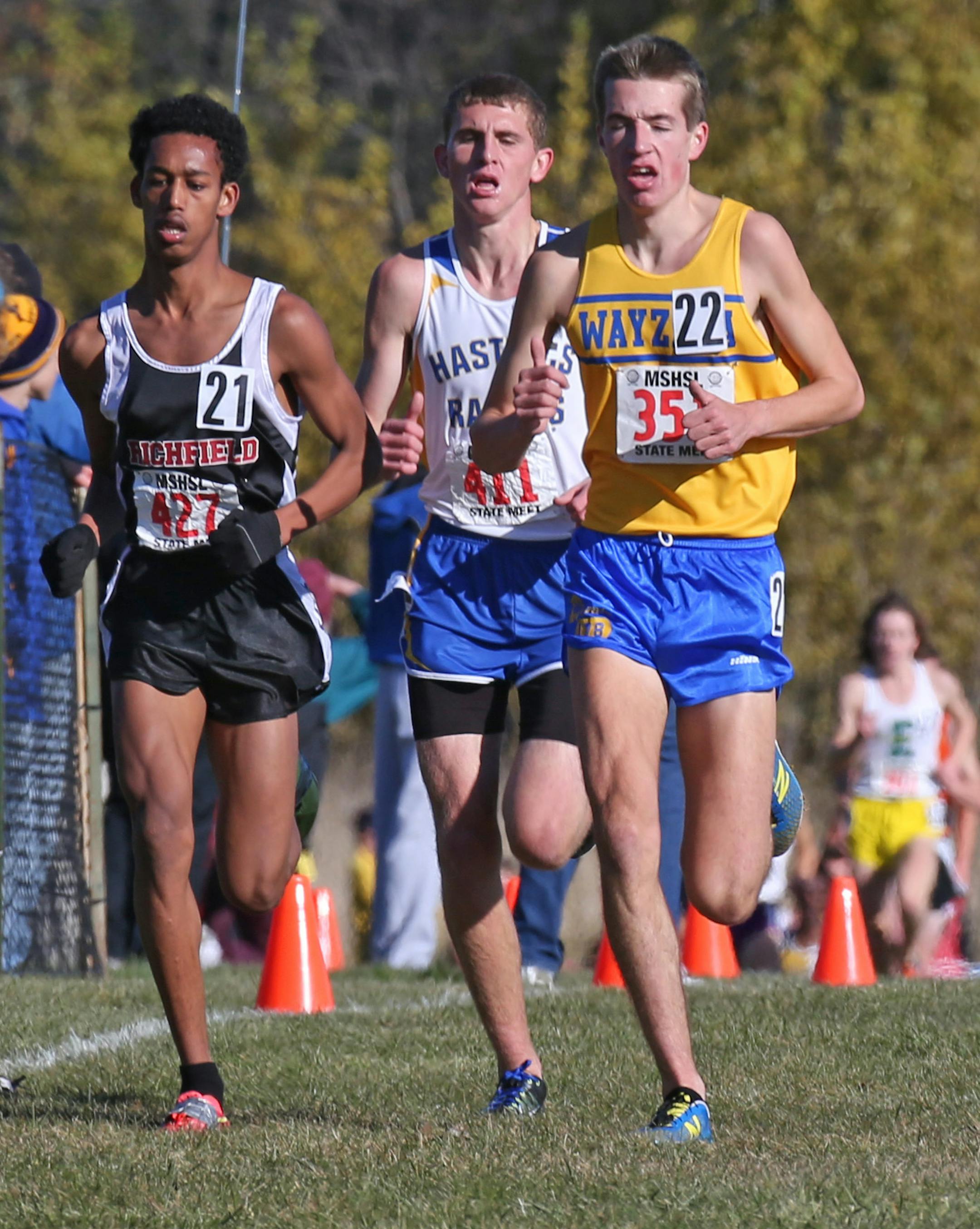 MSHSL State Cross Country Meet, Northfield MN., 11/2/13, Class AA Boys. (left to right) Obsa Ali of Richfield, Zach Benning of Hastings and Connor Olson of Wayzata ran close during the Boys Class AA cross country race at Northfield.] Bruce Bisping/Star Tribune bbisping@startribune Obsa Ali, Zach Benning, Connor Olson/roster. ORG XMIT: MIN1311021545246284
