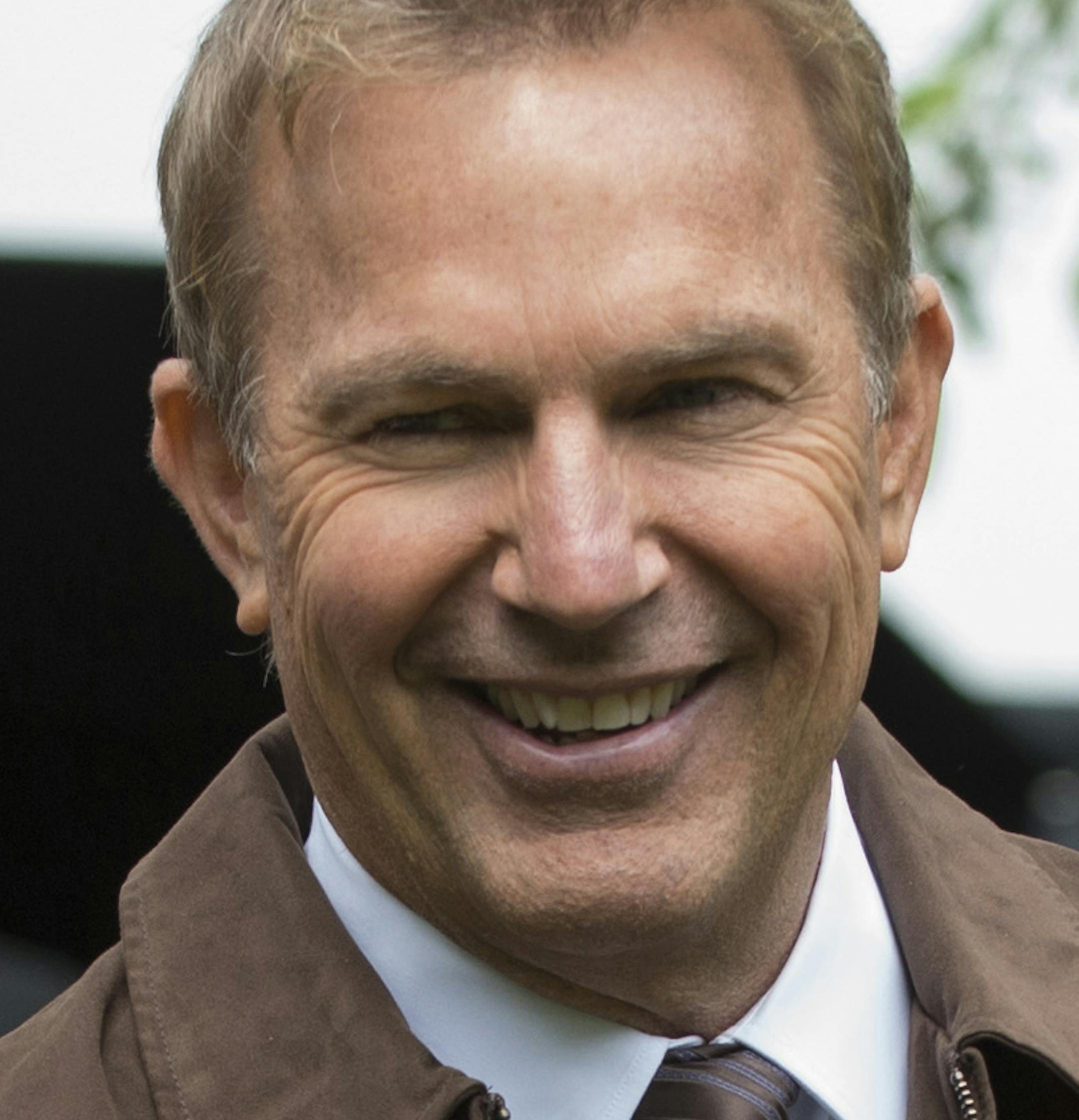 This image released by Summit Entertainment shows Rajiv Joseph, left, Kevin Costner, center, and Scott Rothman in a scene from "Draft Day." (AP Photo/Summit Entertainment, Dale Robinette)