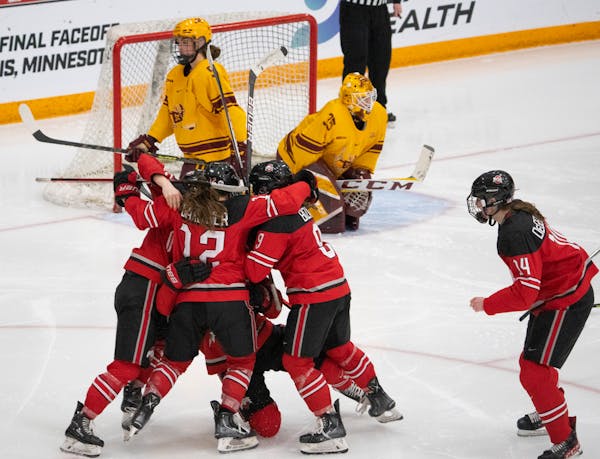 Ohio State’s Sophie Jaques (18) and teammates celebrated her overtime goal against the Gophers in the WCHA championship game March 6 at Ridder Arena