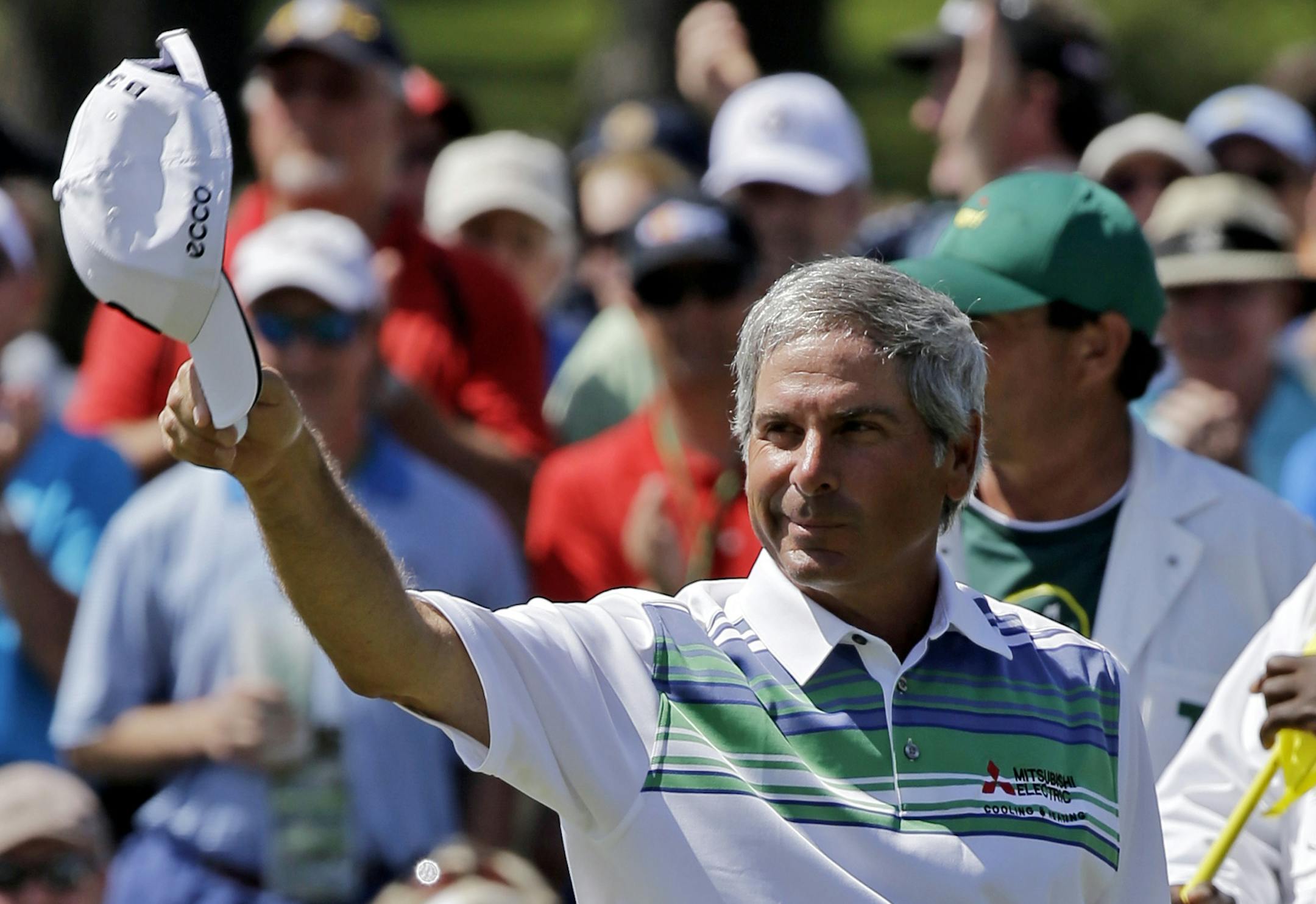 Fred Couples tips his cap after a birdie on the 18th green during the second round of the Masters golf tournament Friday, April 12, 2013, in Augusta, Ga. (AP Photo/David J. Phillip)