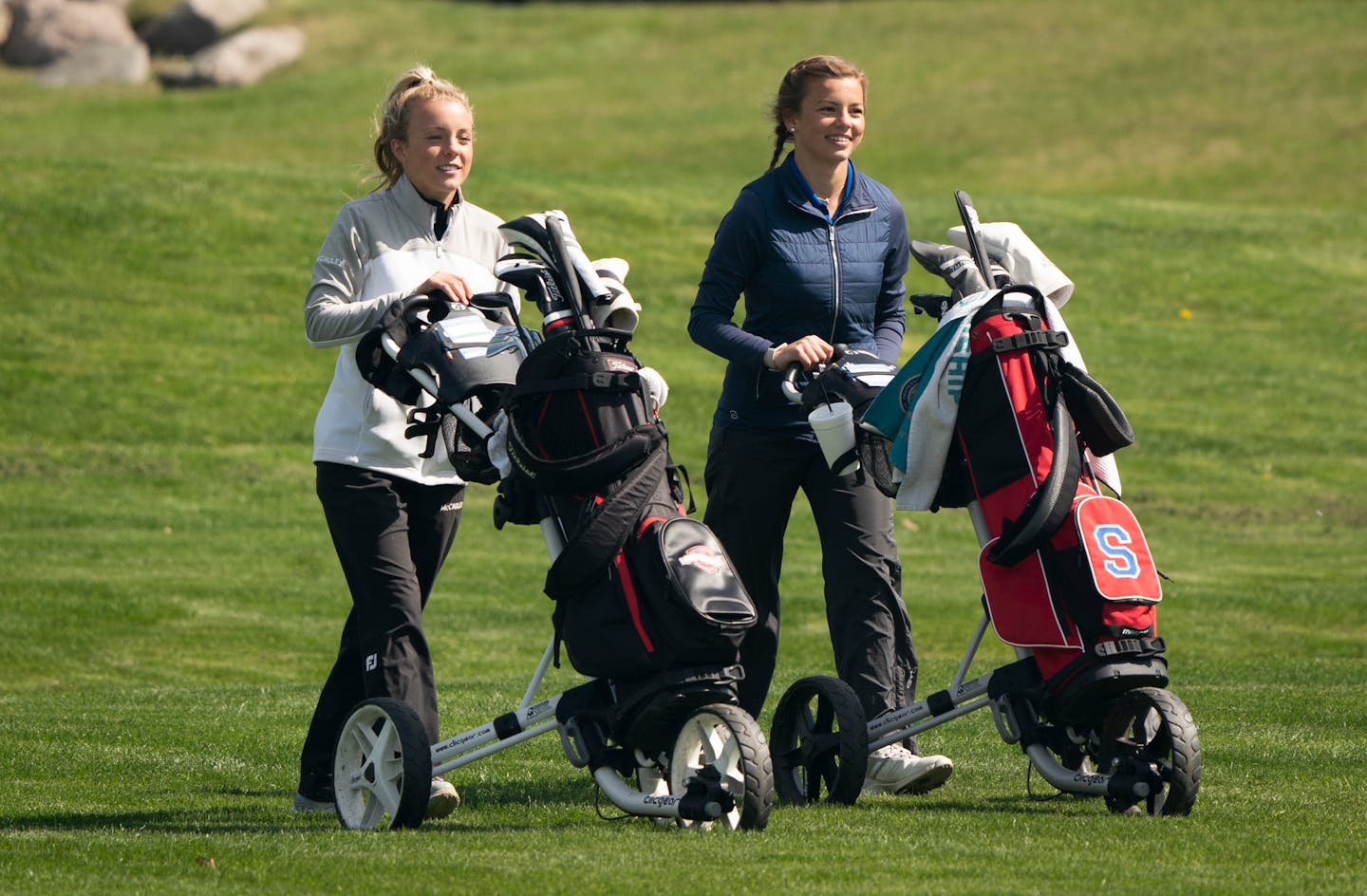 Isabella McCauley, a Simley High School junior who recently qualified for the women's U.S. Open, walked to her ball with her sister Reese McCauley during a meet at Rich Valley Golf Club in Rosemount, Minn., on Thursday, May 6, 2021. She made the 25 foot put. ] RENEE JONES SCHNEIDER ¥ renee.jones@startribune.com