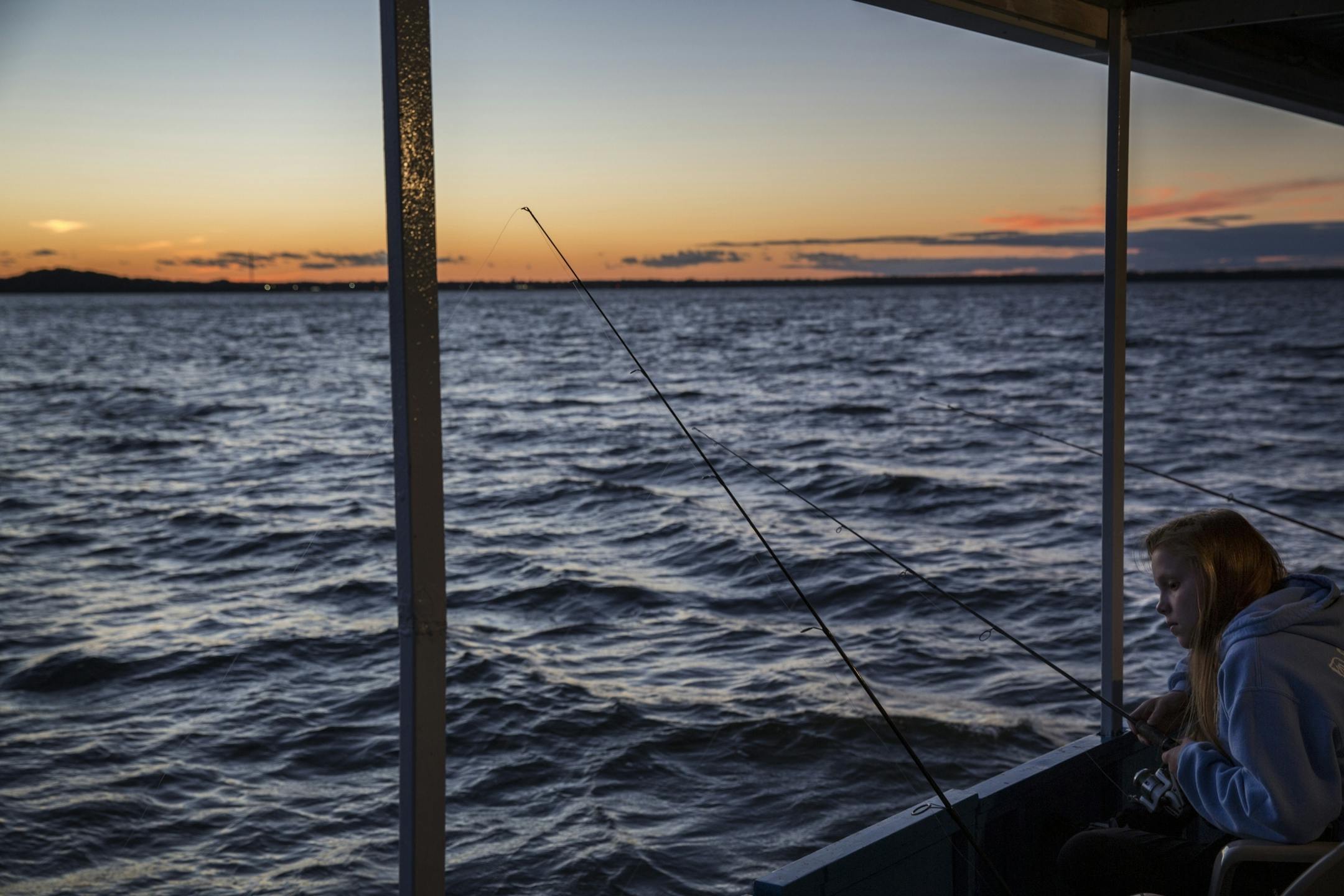 Emily Biondo, 17, of Chicago looks for fish during a fishing expedition with Twin Pines Resort on Mille Lacs Lake Monday, August 3, 2015.