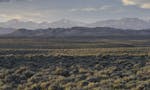 An expanse of the sagebrush steppe rolls toward sandstone foothills and snow-capped peaks in an intermountain basin in Nature's "The Sagebrush Sea." C