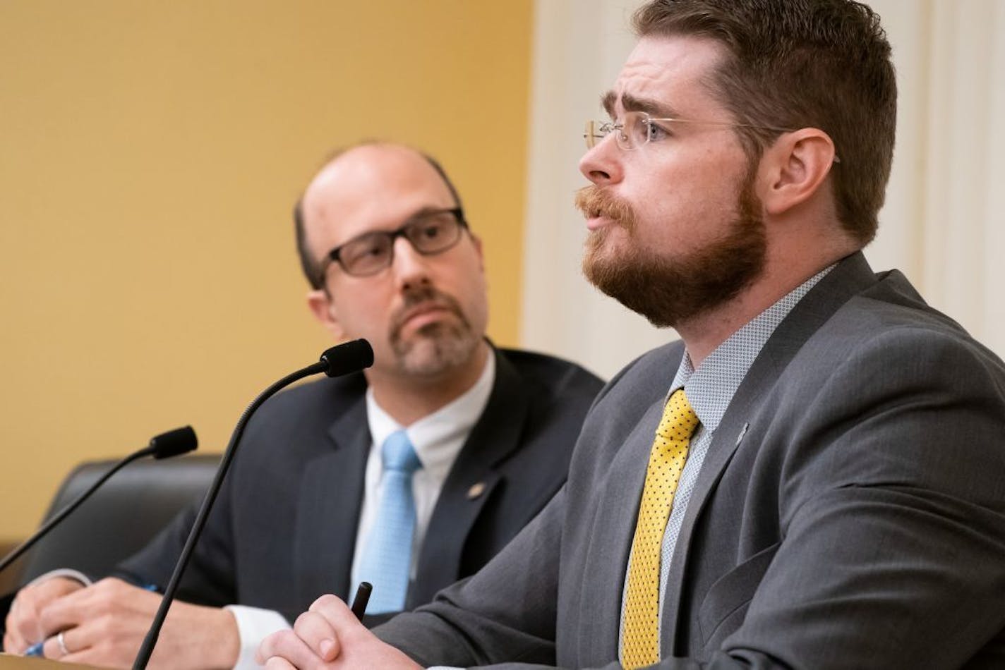 Rep. Dave Pinto, D-St. Paul, listened while Rob Doar of the Minnesota Gun Owners Caucus spoke against his bill.