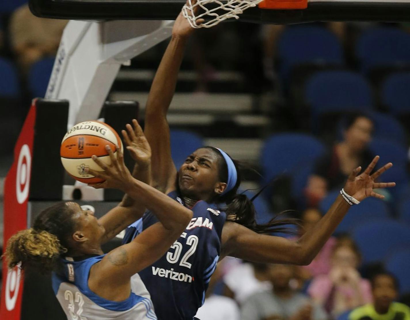 Lynx Rebekkah Brunson(32) is fouled by Elizabeth Williams(52) on the way to the basket.