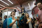 U.S. Sen. Amy Klobuchar and U.S. Trade Rep. Katherine Tai ate ice cream in the Dairy Building at the State Fair on Wednesday.