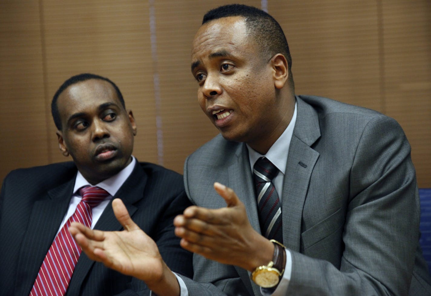 At City Hall, The local chapter of the Somali American Police Association, sergeant Mohamed Abdullahi, right, and officer Abdiwahab Ali, help run the Somali American Police Association, or SAPA, which is being held up as a model for police departments around the country and in Canada.] Richard Tsong-Taatatarii@startribune.com