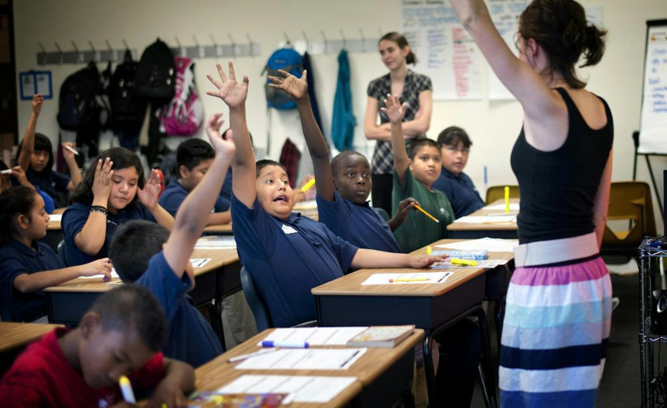 Heather Busch got an enthusiastic response when asking students a question in her reading class at Adelante College Prep. Tuesday, September 11, 2012.