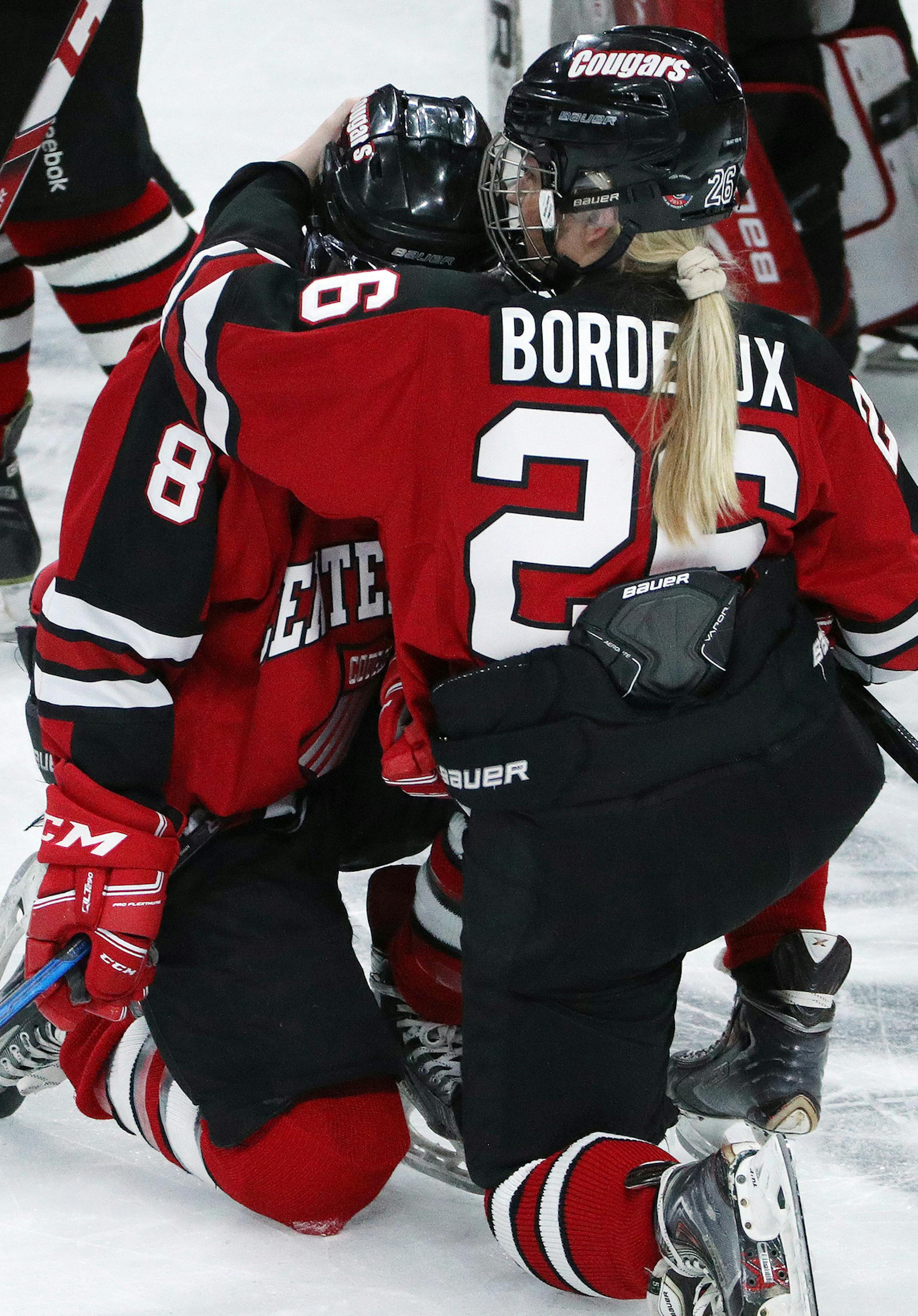 Centennial High School defenseman Alana Bordeaux (26) gave a hug to defenseman Hannah Backman (8) after the loss to Edina High School. ] ANTHONY SOUFFLE ï anthony.souffle@startribune.com Game action from a MSHSL Class 2A girl's hockey championship game between Edina High School and Centennial High School Saturday, Feb. 24, 2018 at the Xcel Energy Center in St. Paul, Minn.