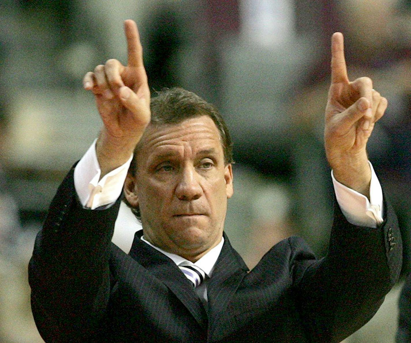 Flip Saunders signals to his team.