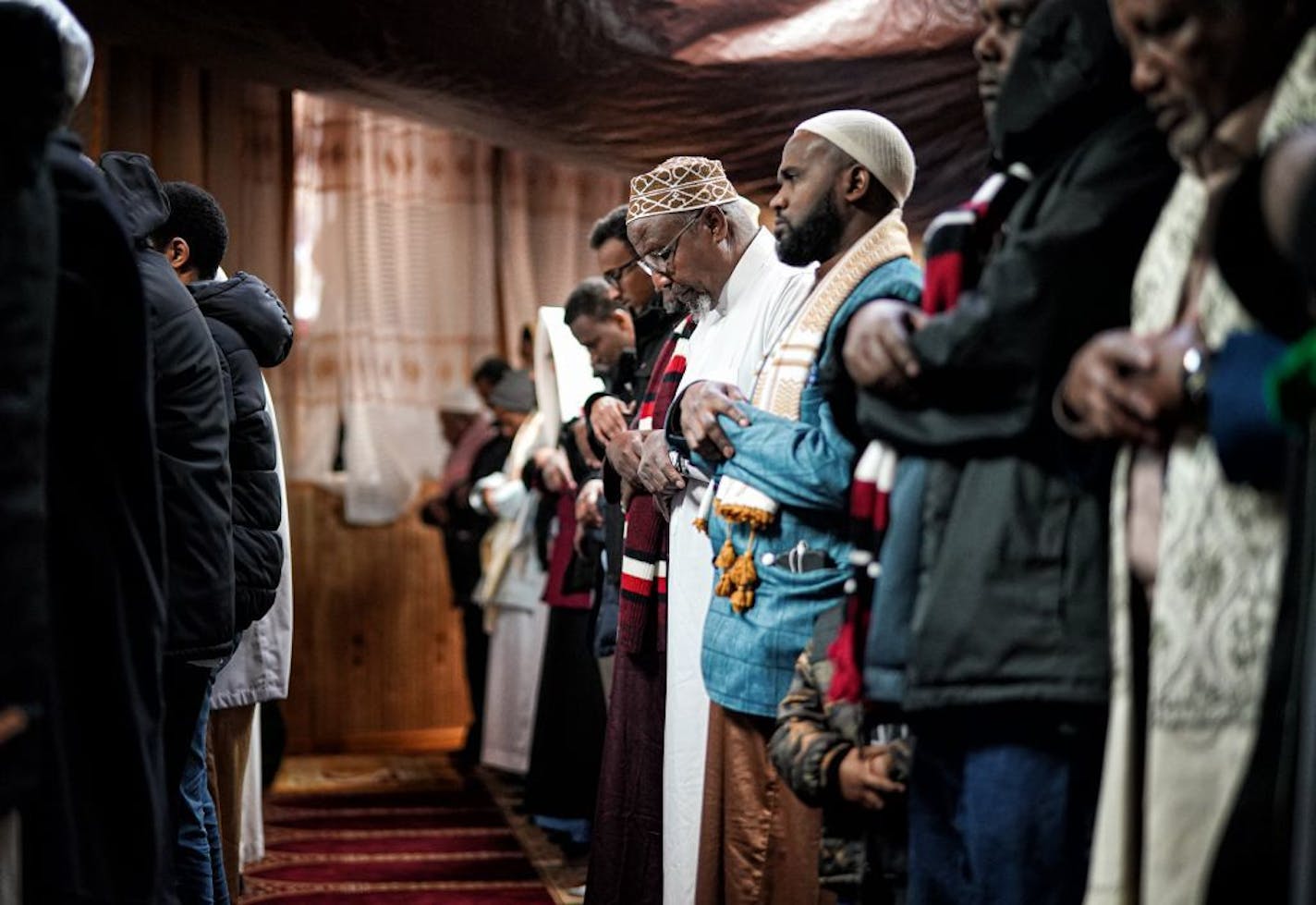 Hussein Hashi Hersi stood at Friday prayers at the Darul-Quba Mosque. His niece Nadi F Mohamud was killed in the Wednesday morning fire.