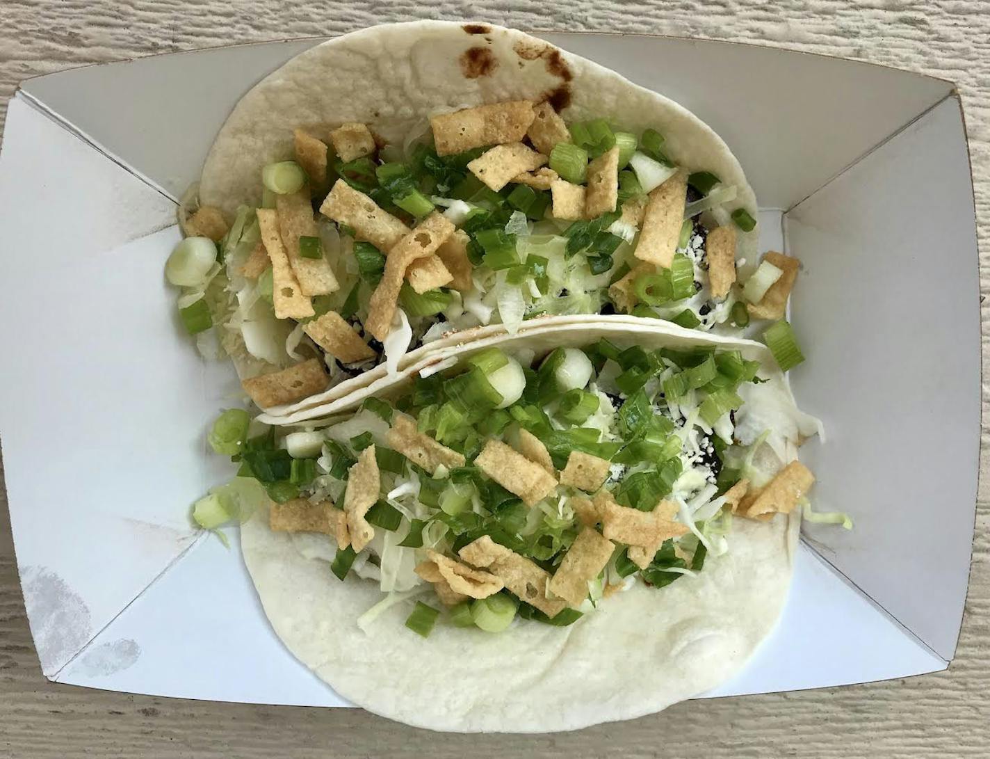 Smoked Black Bean Tacos, Taco Cat, International Bazaar, $10. Too bad the stand is only around until Aug. 28, because this is primo vegetarian fare. Love the smoked beans, love the crunchy cabbage slaw. Next year, Taco Cat, won't you stay the whole 12 days?
Photo by Rick Nelson
New food at the Minnesota State Fair 2018