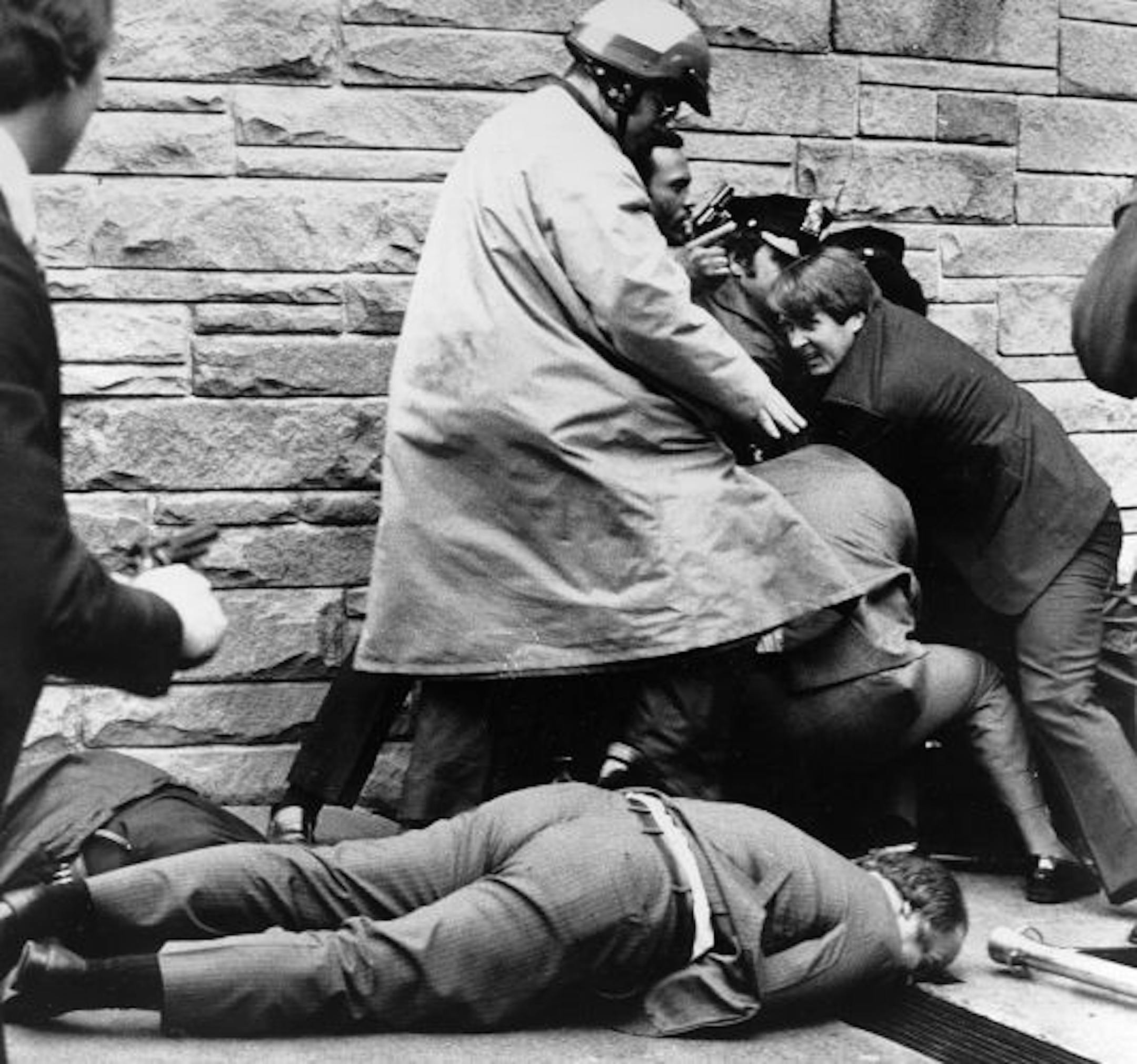 Ronald Reagan's press secretary, James Brady, lay wounded on March 30, 1981, after an assassination attempt on the president.