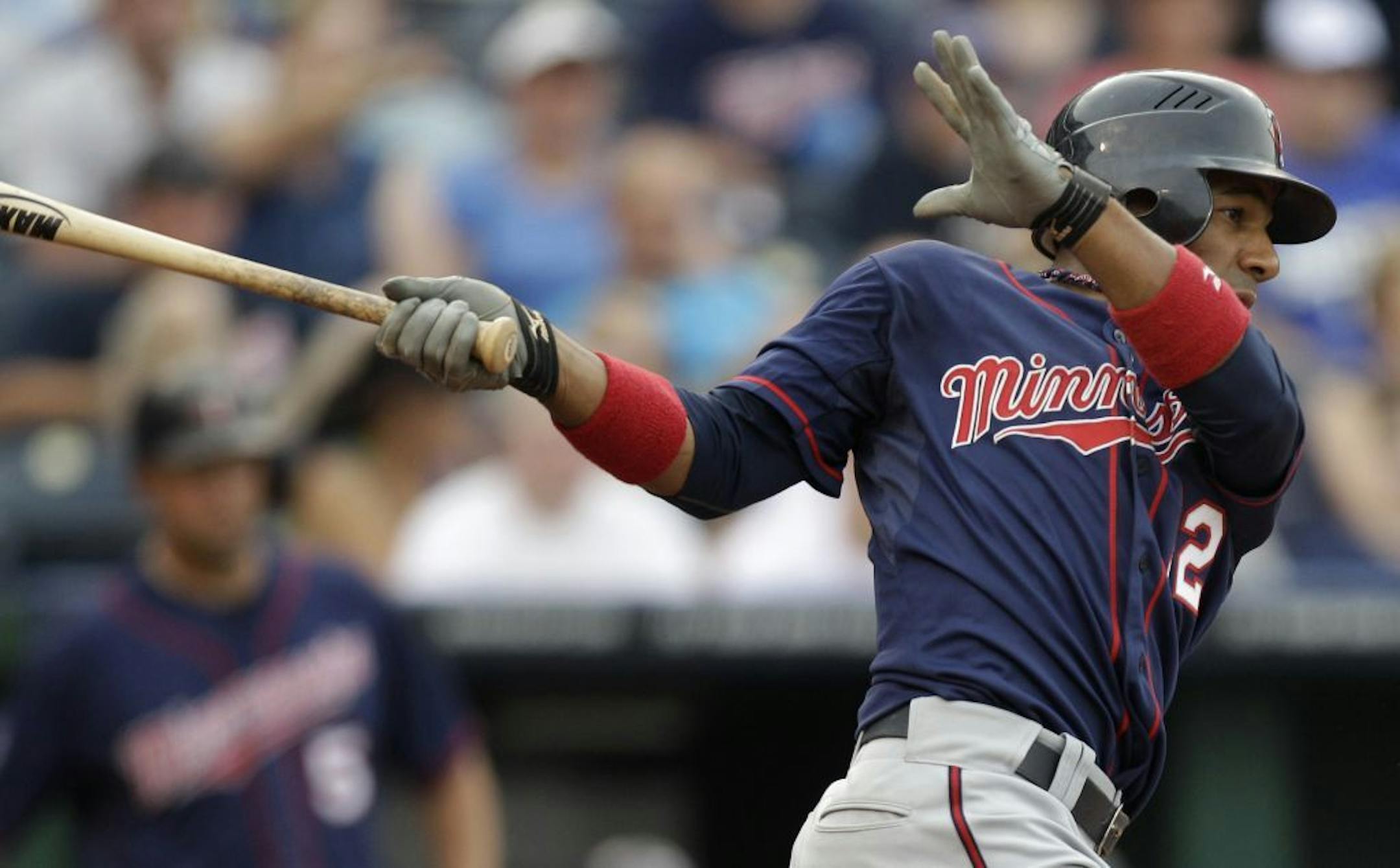Minnesota Twins' Alexi Casilla hits an RBI single during the third inning of a baseball game against the Kansas City Royals, Saturday, June 4, 2011, in Kansas City, Mo.