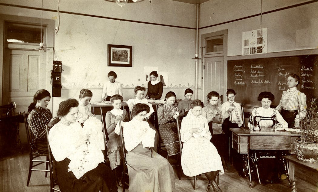 Students attended a sewing class in the 1890s.