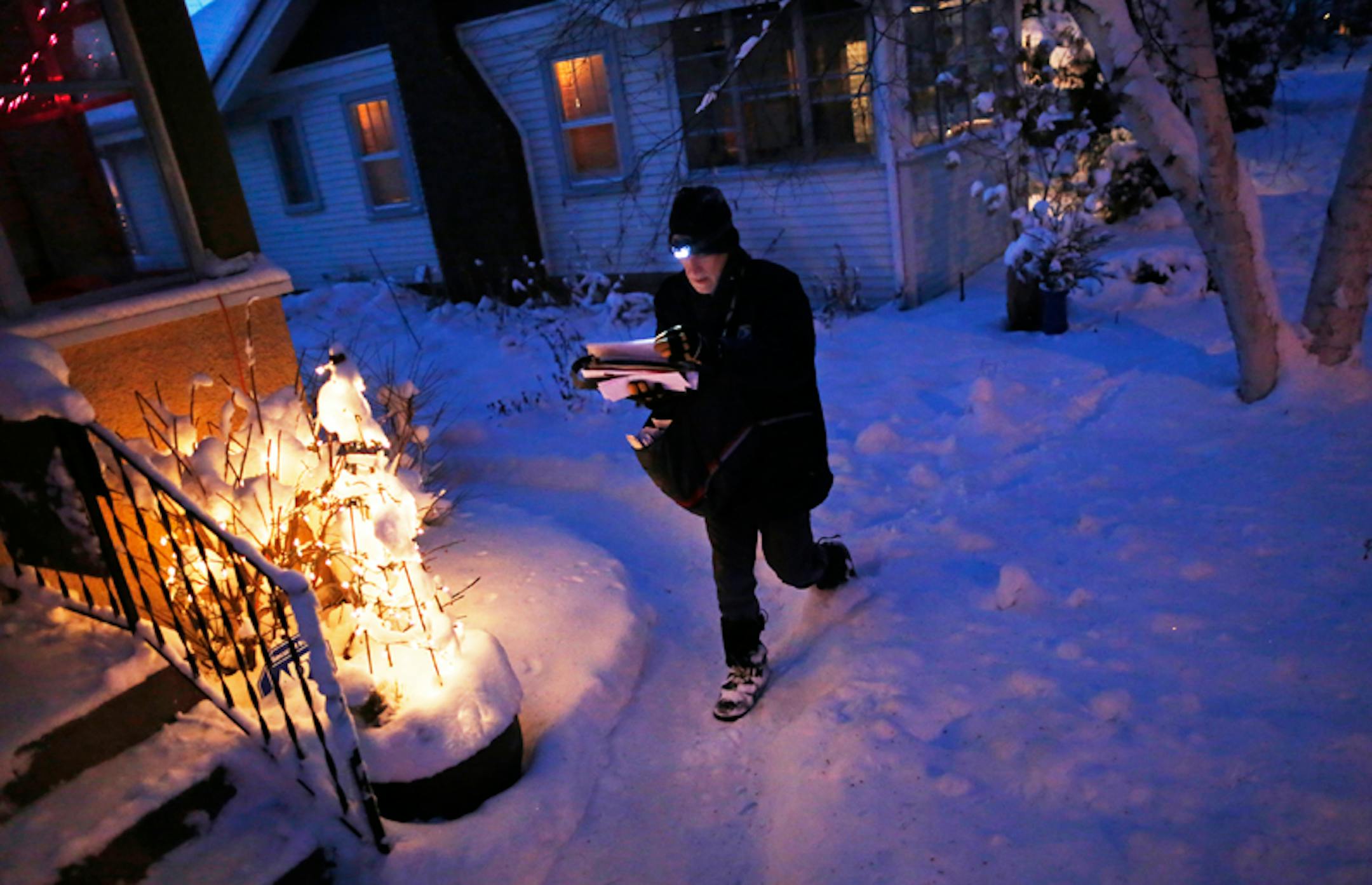 In the Longfellow neighborhood of South Minneapolis, 18-year veteran mail carrier Greg Wallin was trudging through the snow finishing up his mail delivery on schedule in spite of the weather. "It's pretty. You dress for it and it's o.k."