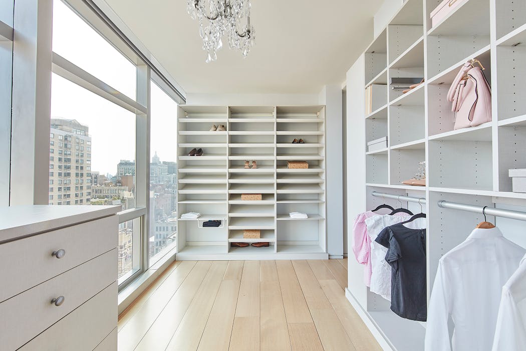 Built-in shelves help to create an organized closet.