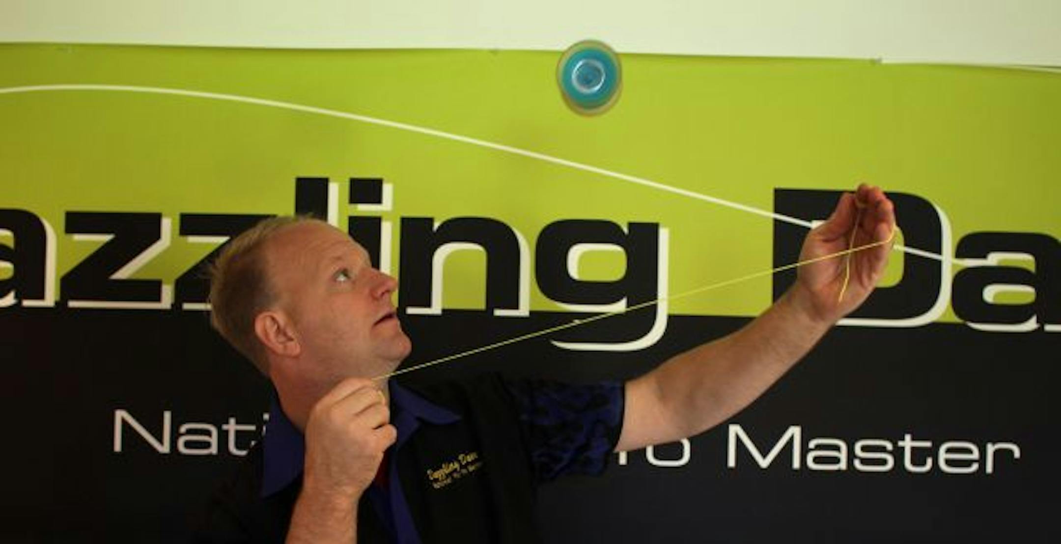 Dave Schulte, aka "Dazzling Dave" of Brooklyn Park, played with a detached yo-yo in his home. Schulte makes his living yo-yoing. He teaches it, judges it, and even sets new world records with his tricks to promote his craft. Recently he received confirmation that he had established a new Guinness world record.