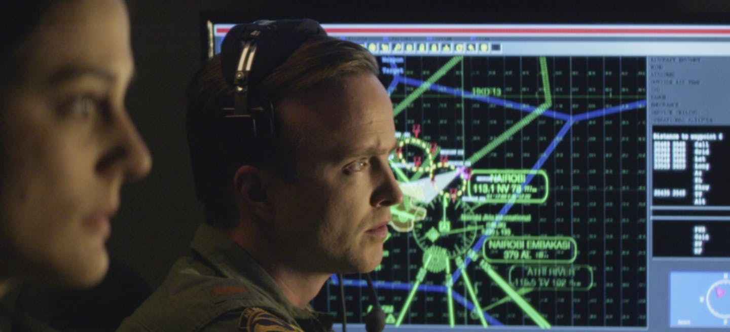 This image released by Bleecker Street shows Phoebe Fox, left, and Aaron Paul in a scene from "Eye In the Sky." (Keith Bernstein/Bleecker Street via AP) ORG XMIT: MIN2016031415314143