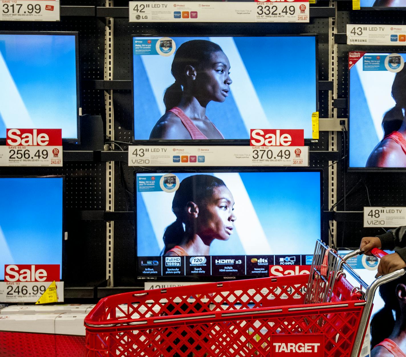 Olga Marrero, of McGaheysville, Va., browses through the electronics section of Target during a Thanksgiving sale in Harrisonburg, Va., Thursday, Nov. 26, 2015. (Daniel Lin/Daily News-Record via AP) MANDATORY CREDIT ORG XMIT: MIN2015122817064579