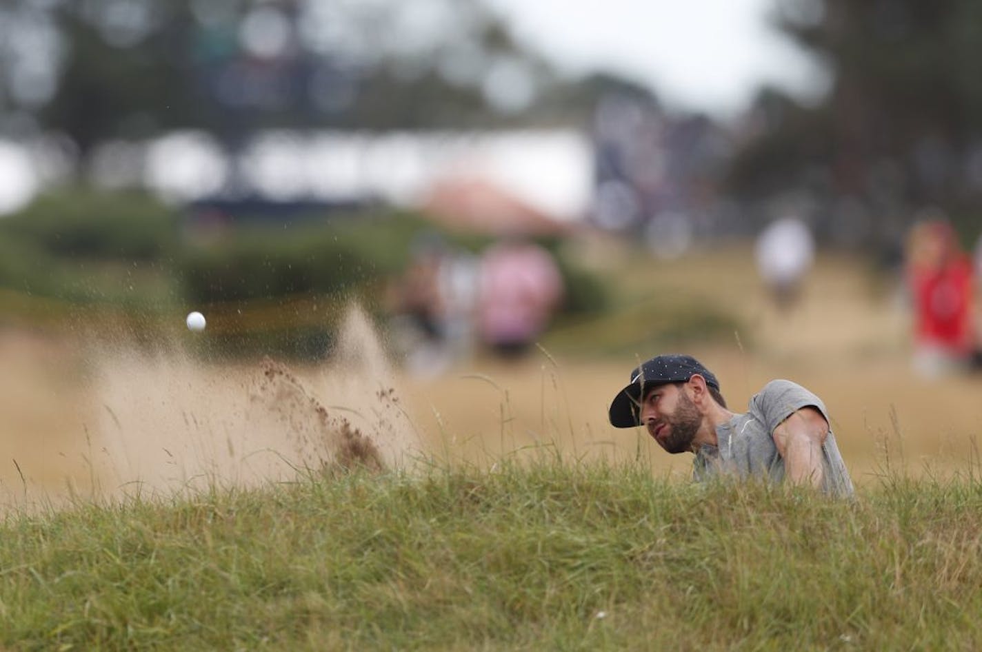 Former Gophers golfer Erik Van Rooyen of South Africa played out of a bunker on the ninth hole during the final round of the British Open in Carnoustie, Scotland, on Sunday.