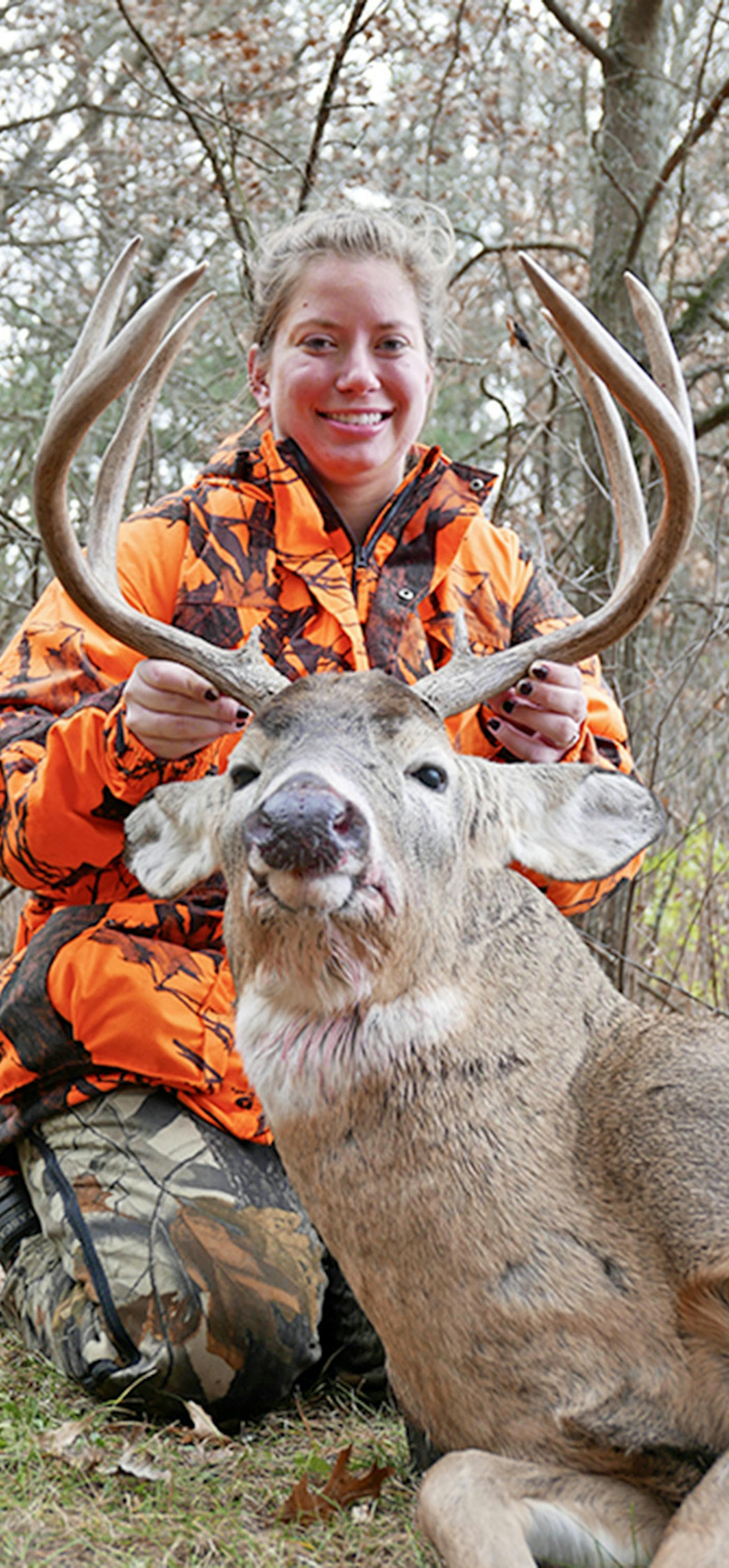 Allie Skogland, 26, of Minneapolis, with a heavy 8-pointer she shot on her parents' land near Black River Falls, Wisc.