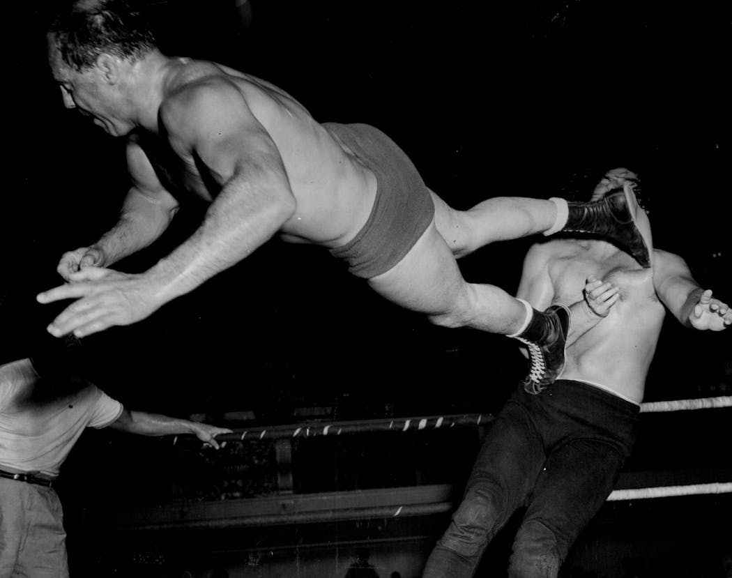Vern Gagne delivered a flying dropkick to Tiny Mills during a match at the Minneapolis Auditorium in 1960.