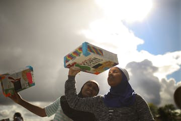 Children watched the August 2017 total solar eclipse with a pinhole projector camera outside the Hennepin County Library branch in Brooklyn Park.