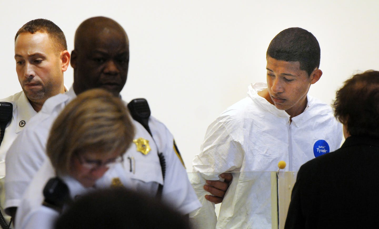 Philip Chism, 14, stands during his arraignment for the death of Danvers High School teacher Colleen Ritzer in Salem District Court in Salem, Mass., Wednesday, Oct. 23, 2013. Chism has been ordered held without bail. (AP Photo/Boston Herald, Patrick Whittemore) MANDATORY CREDIT