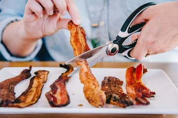 The "Baller Bacon" comes with shears so you can cut the thick bacon strip into shareable pieces.