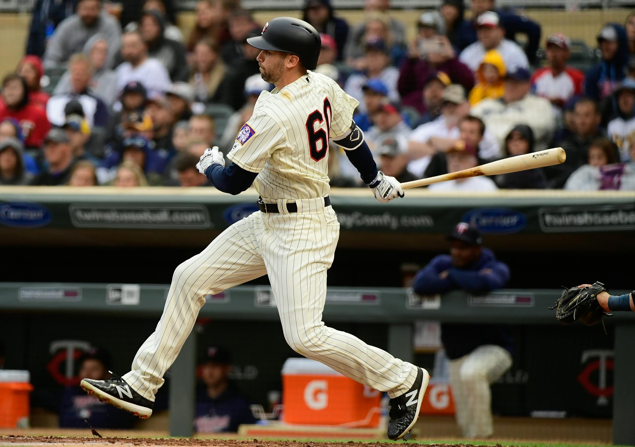Minnesota Twins center fielder Jake Cave (60) followed through with his swing as he hit a single in the bottom of the second inning against the Milwaukee Brewers. This was Cave's hitting debut in the MLB. ] AARON LAVINSKY � aaron.lavinsky@startribune.com The Minnesota Twins played the Milwaukee Brewers on Saturday, May 19, 2018 at Target Field in Minneapolis, Minn.