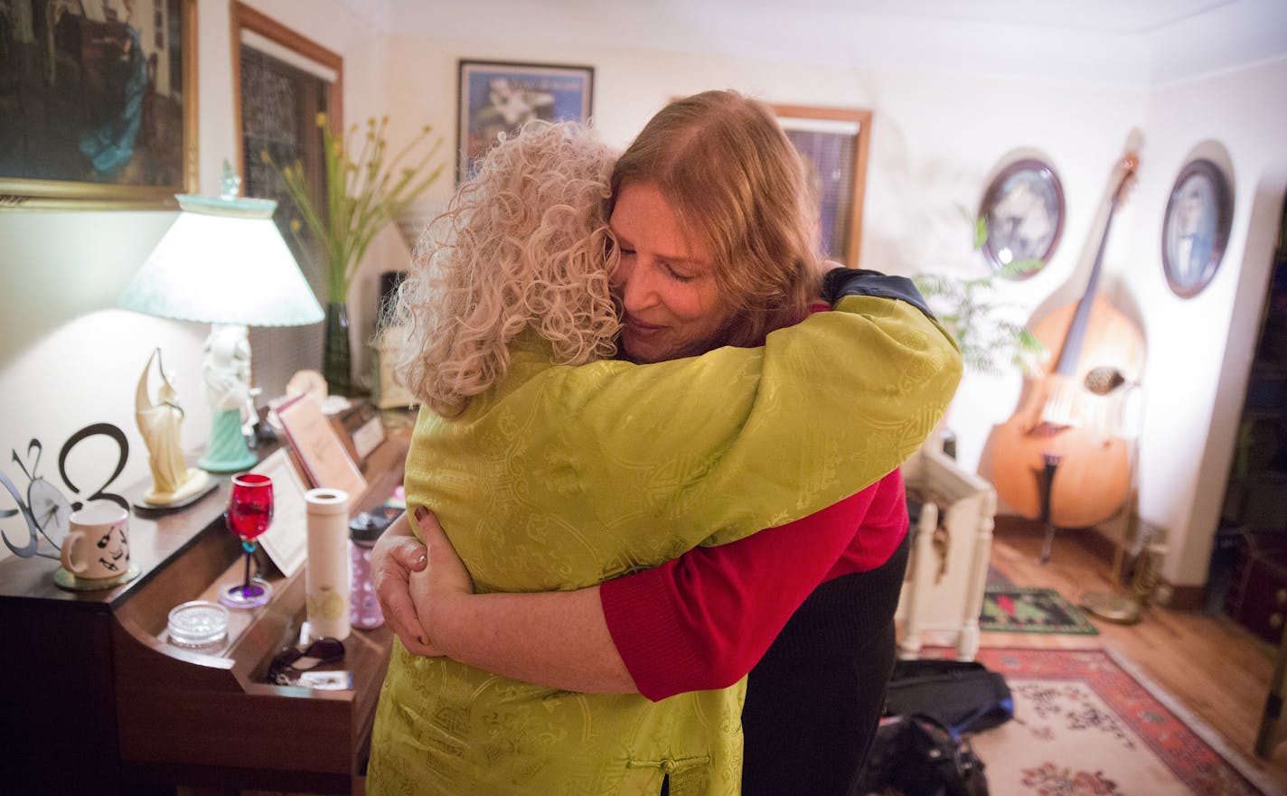 Anita Kozan, left, a speech and language pathologist who specializes in voice, and her client Marie Fromm embrace at Kozan's home office in Minneapolis on Wednesday, March 4, 2015. Fromm, a transgender female, came to Kozan to help make her voice sound more feminine during her transition. ] LEILA NAVIDI leila.navidi@startribune.com /