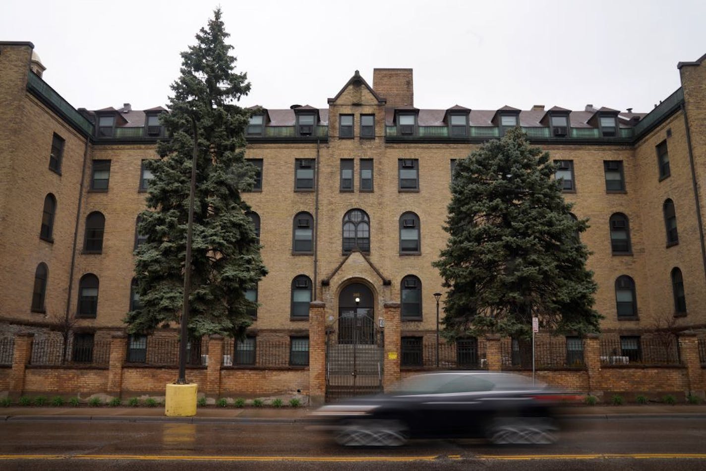 A light rain fell on the Stonehouse Square Apartments as a car passed by Tuesday.