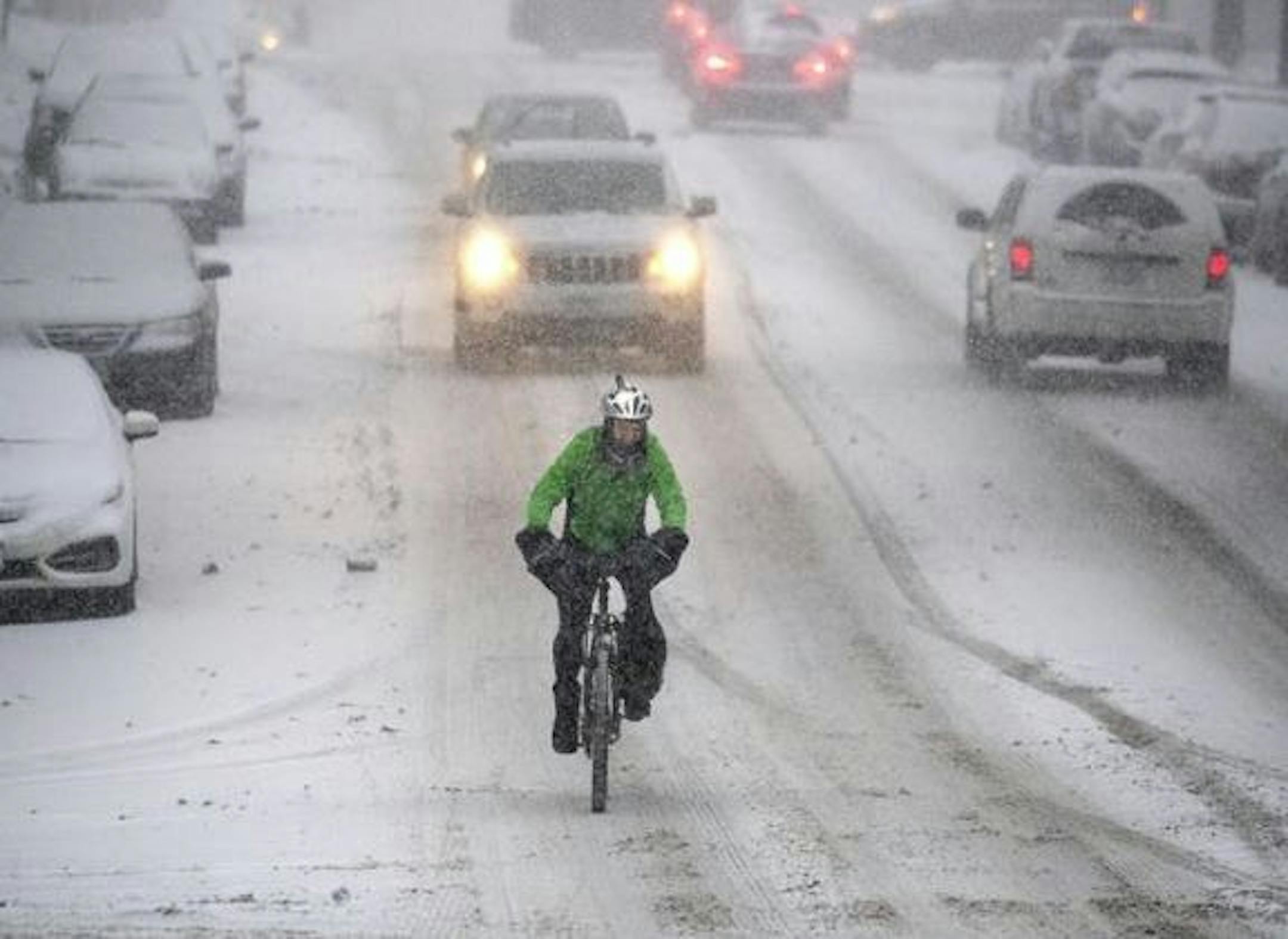 A December snowfall made for a challenging commute for this St. Paul bicyclist. Credit: Elizabeth Flores/Star Tribune