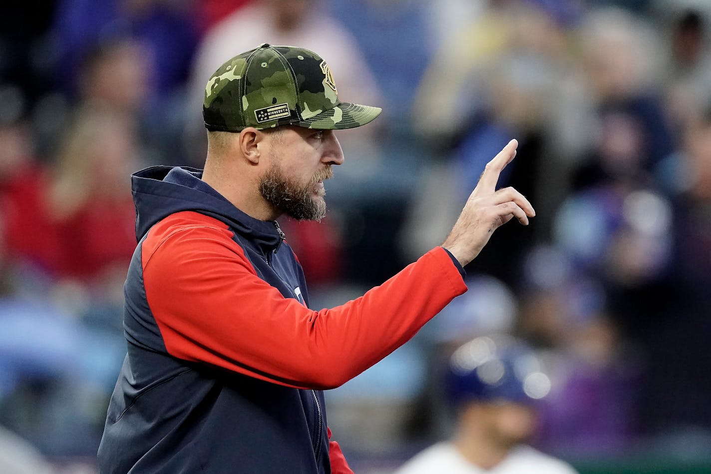 Minnesota Twins manager Rocco Baldelli motions to the bullpen while making a pitching change during the seventh inning of a baseball game against the Kansas City Royals Saturday, May 21, 2022, in Kansas City, Mo. (AP Photo/Charlie Riedel)