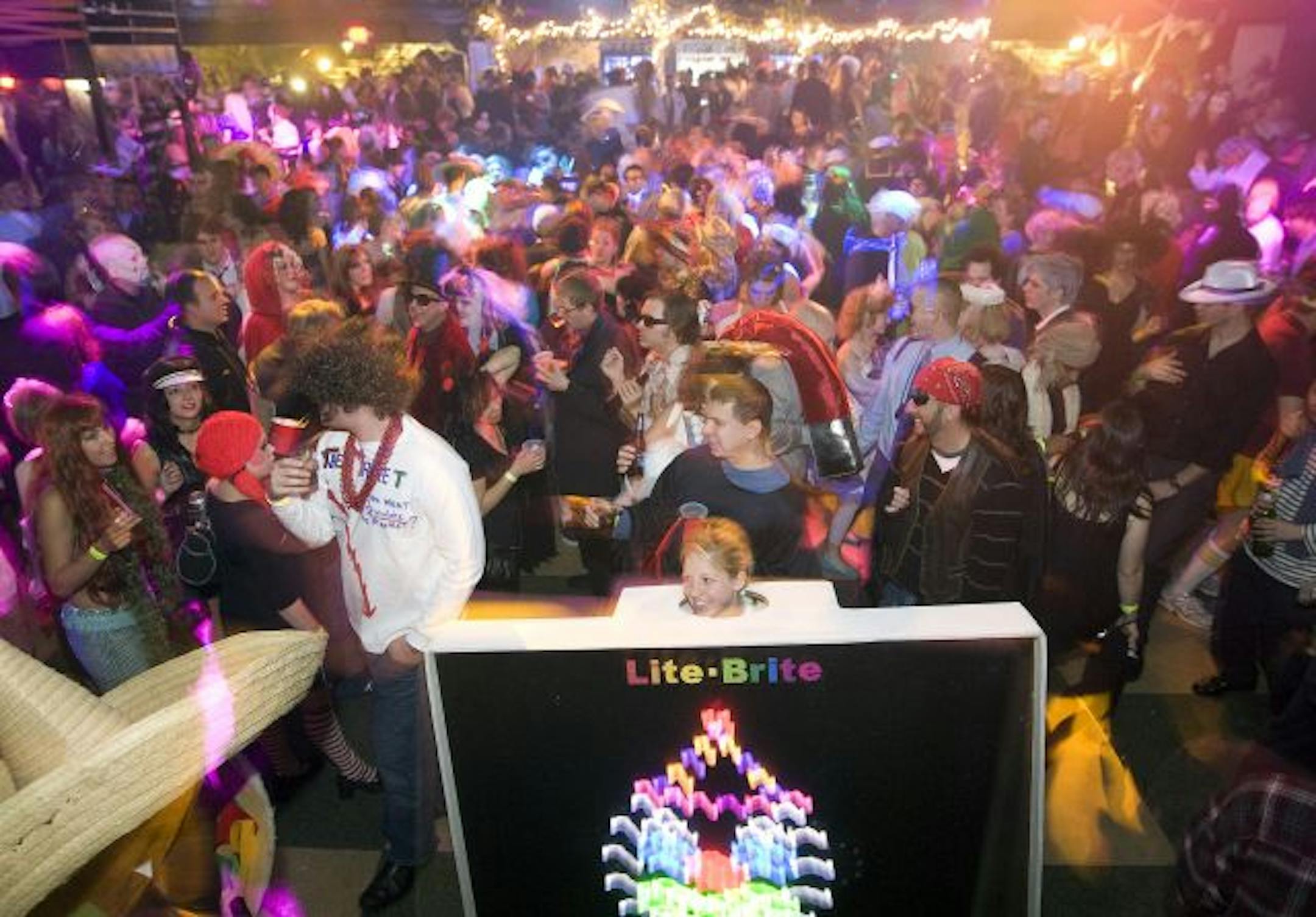 TOM WALLACE � twallace2@startribune.com Assign#00005471A Slug: hallween1106 October 31, 2008 First Ave. Huge Halloween party brings everybody out for the party. The house was maxed out with the characters from every walk of life you could imagine.[The crowd and standing out id Lite Brite Jennifer Humel.