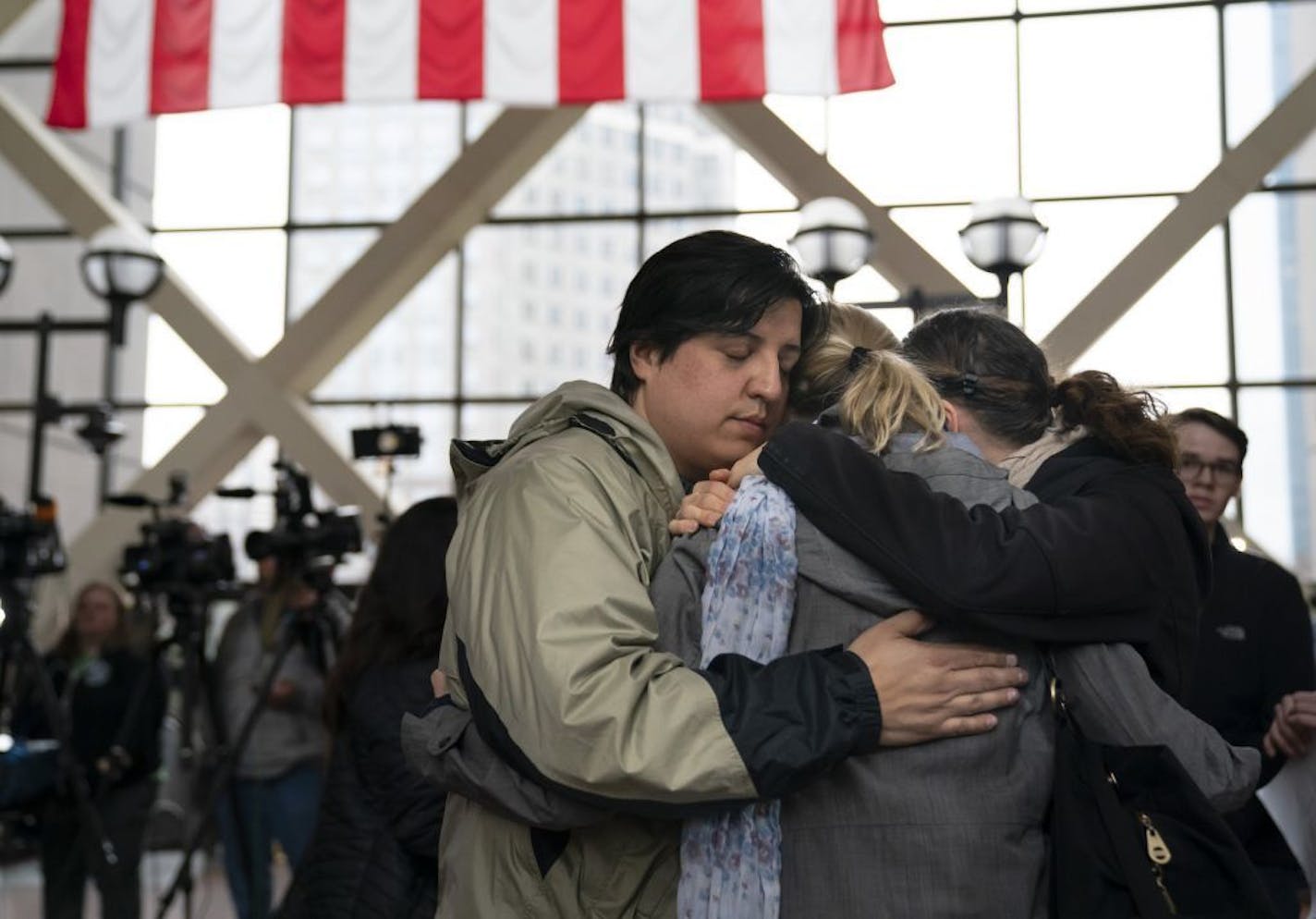 Ryan Masterson and his wife, Jenelle, right, hugged Sarah Kuhnen after former Minneapolis police officer Mohamed Noor was found guilty of third-degree murder and manslaughter in the death of Justine Ruszczyk Damond.