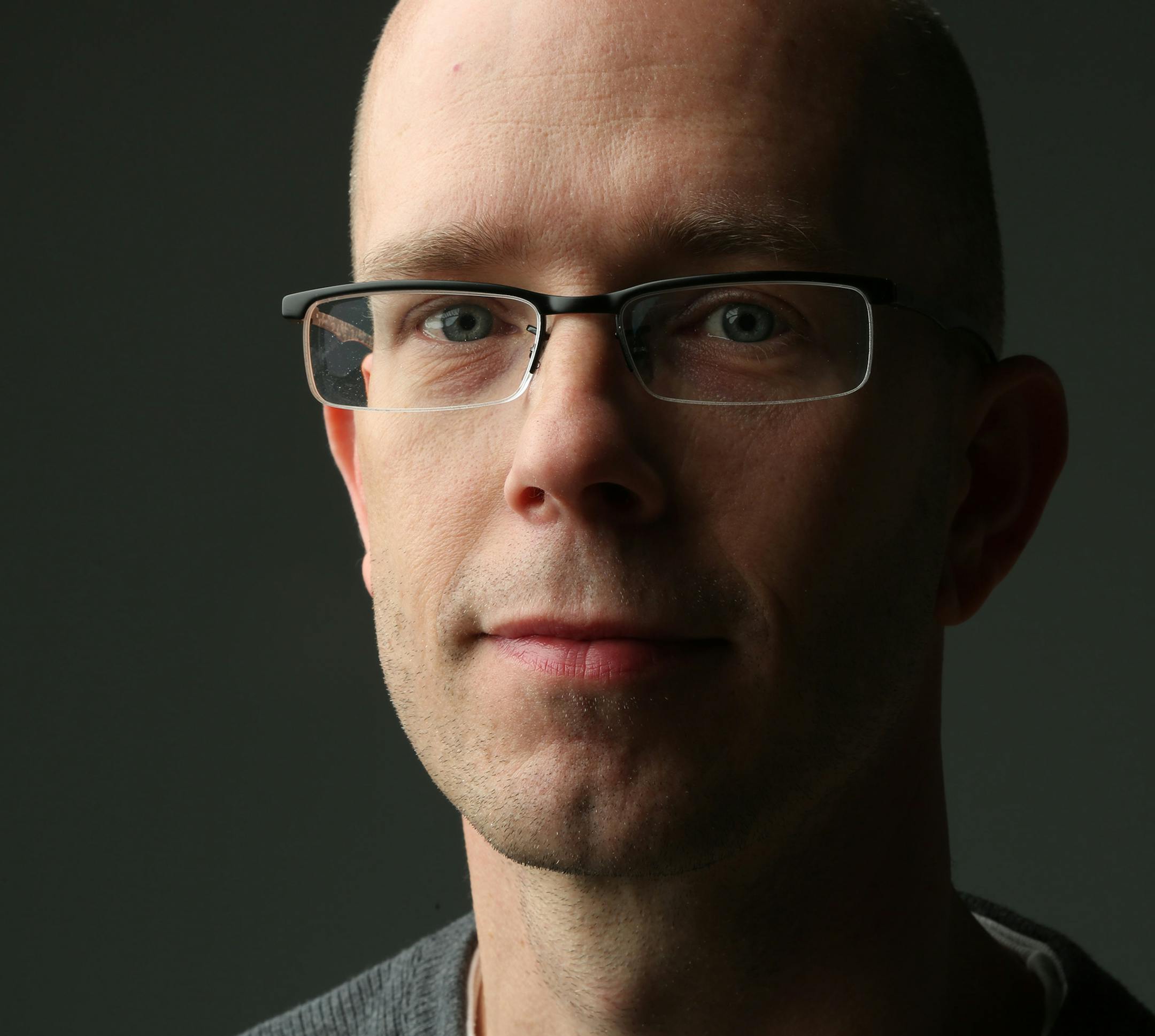 Christopher Nelson worked at his stepfather's marketing agency for 15 years before the urge to change careers hit and he went into law enforcement. ] (KYNDELL HARKNESS/STAR TRIBUNE) kyndell.harkness@startribune.com Christopher Nelson formally worked marketing agency is now a detective in the Hastings Police Department. the picture was shot at the office in Minneapolis Min., Thursday November 5, 2015.