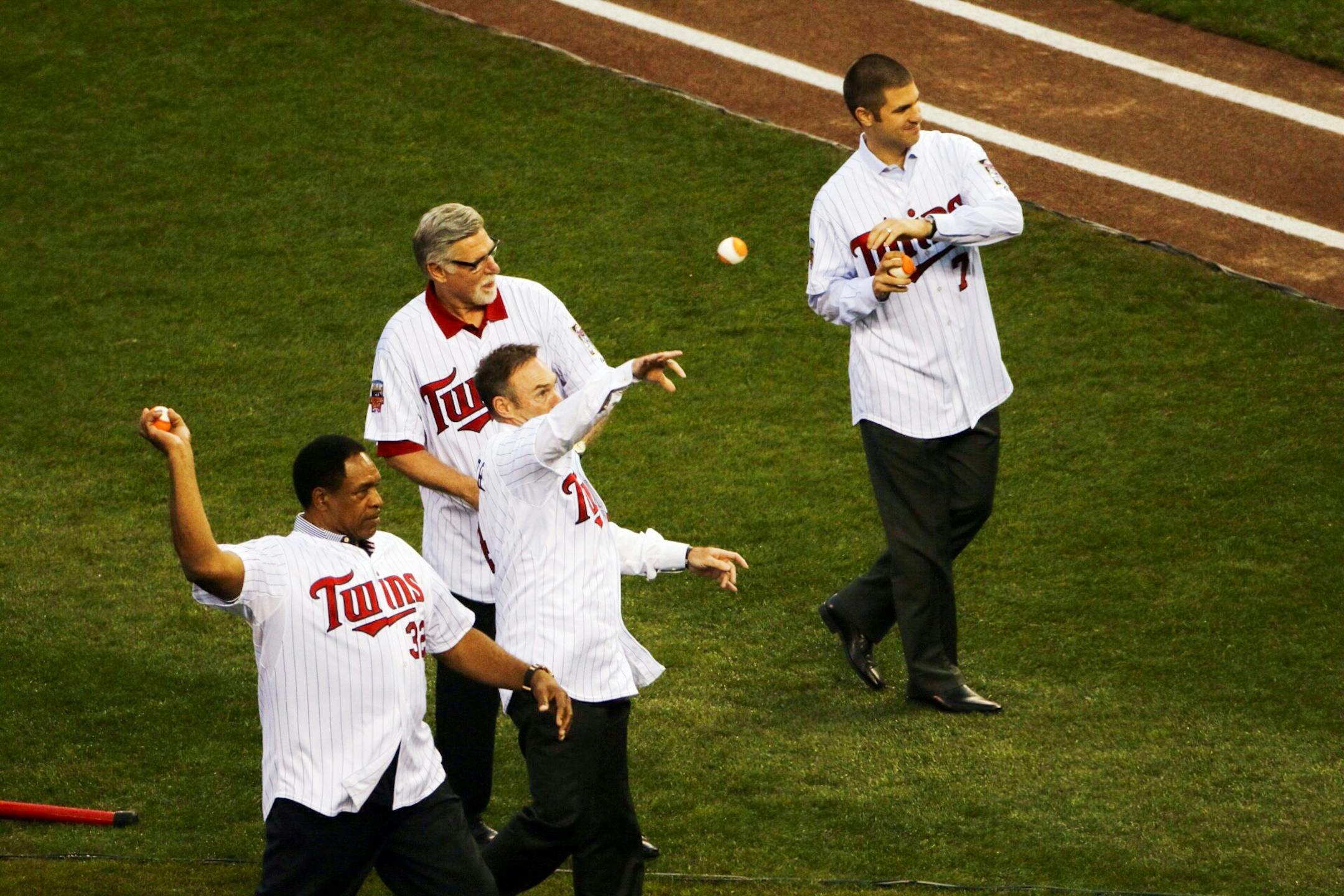 Former and current Twins players Dave Winfield, Paul Molitor, Jack Morris, and Joe Mauer throw out the first pitches at the home run derby.