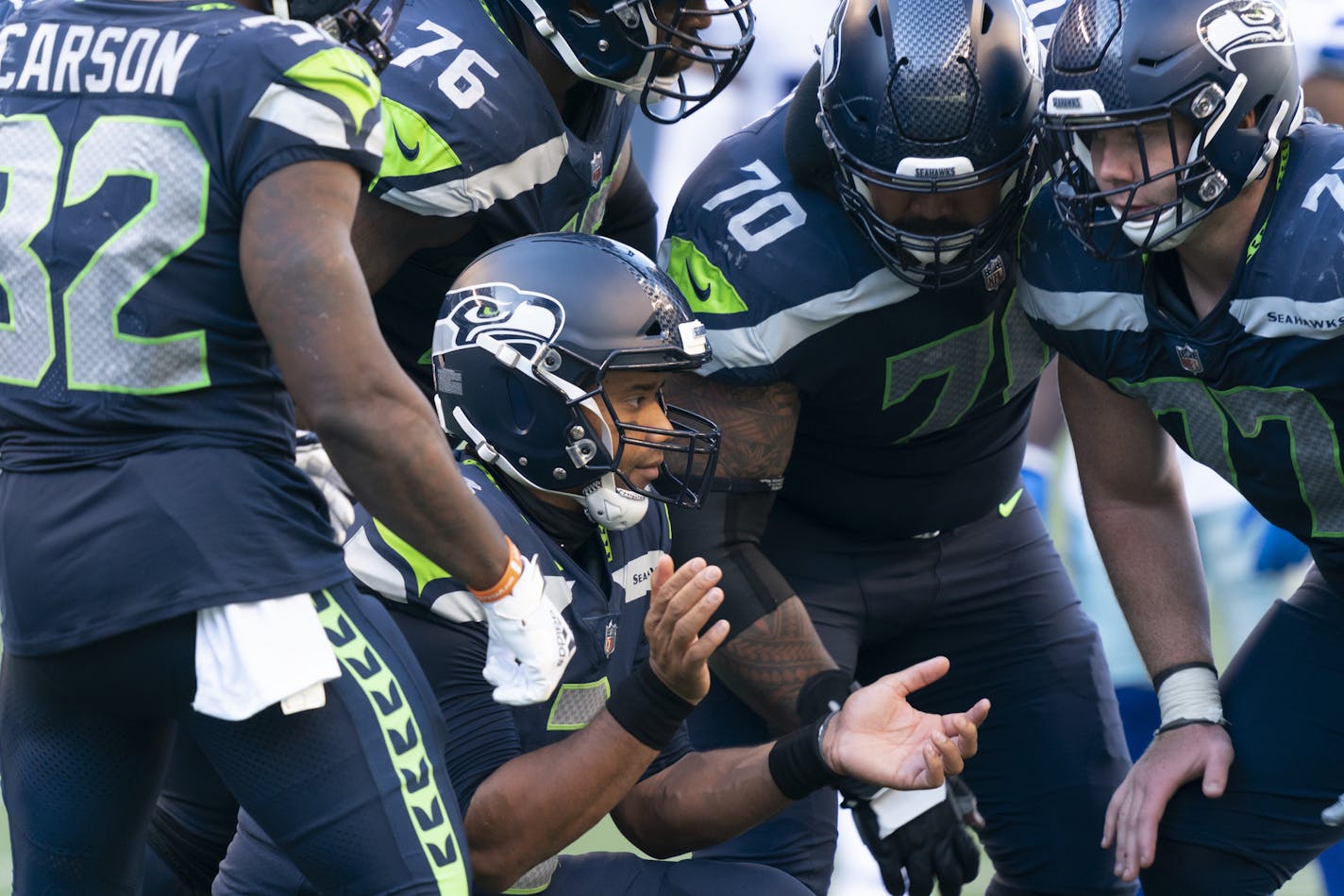 Seattle Seahawks quarterback Russell Wilson breaks the huddle during the second half of an NFL football game against the Dallas Cowboys, Sunday, Sept. 27, 2020, in Seattle. The Seahawks won 38-31. (AP Photo/Stephen Brashear)