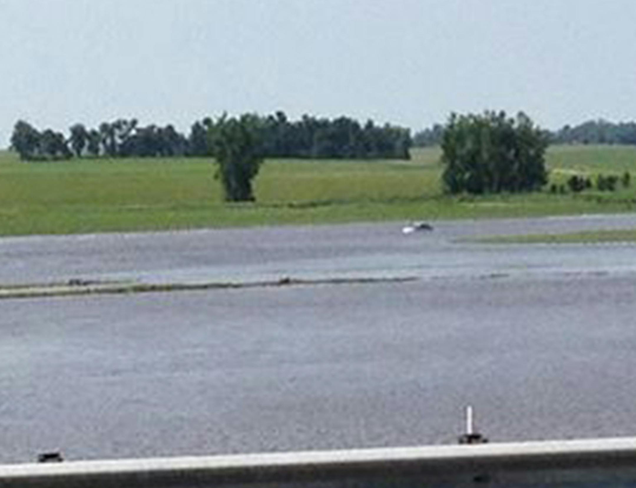 The driver of this car was helped to safety by a state trooper just before her vehicle was washed away in southwestern Minnesota.