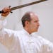 Dr. Russell Smiley (cq/source), tai chi instructor and creator of the tai chi program at Normandale Community College, performed the "Yang 32 Sword Fo