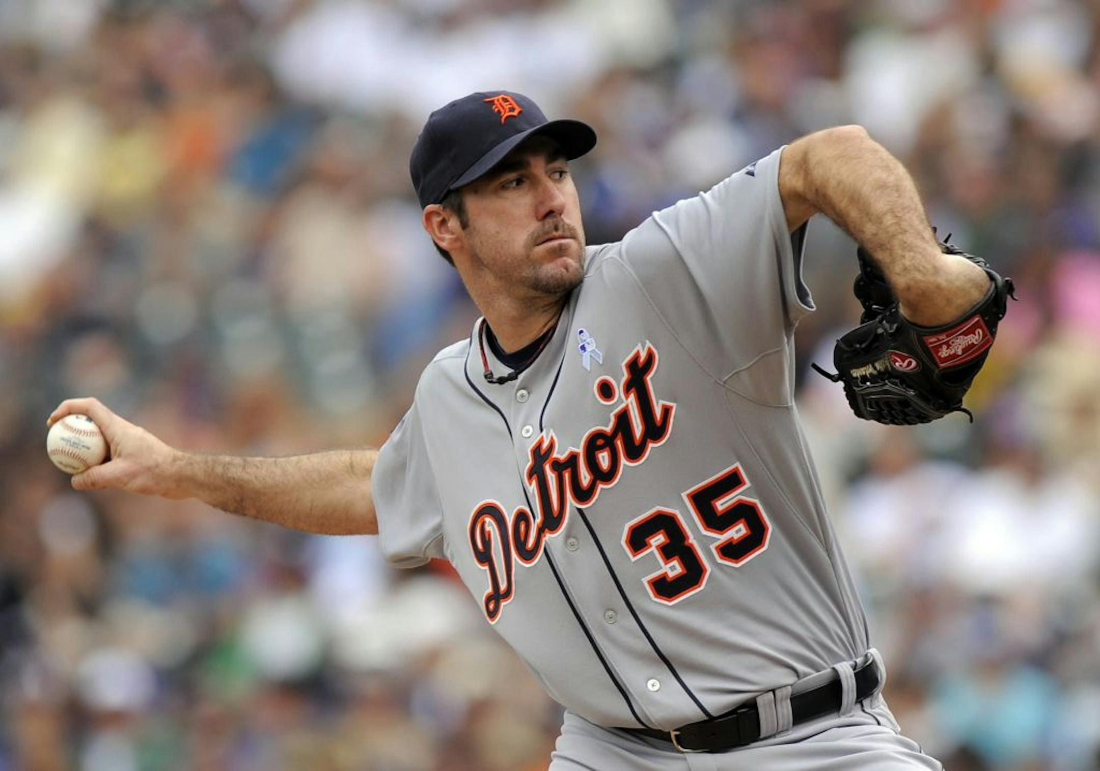 Detroit Tigers pitcher Justin Verlander throws in the first inning of a baseball game against the Colorado Rockies in Denver on Sunday, June 19, 2011.
