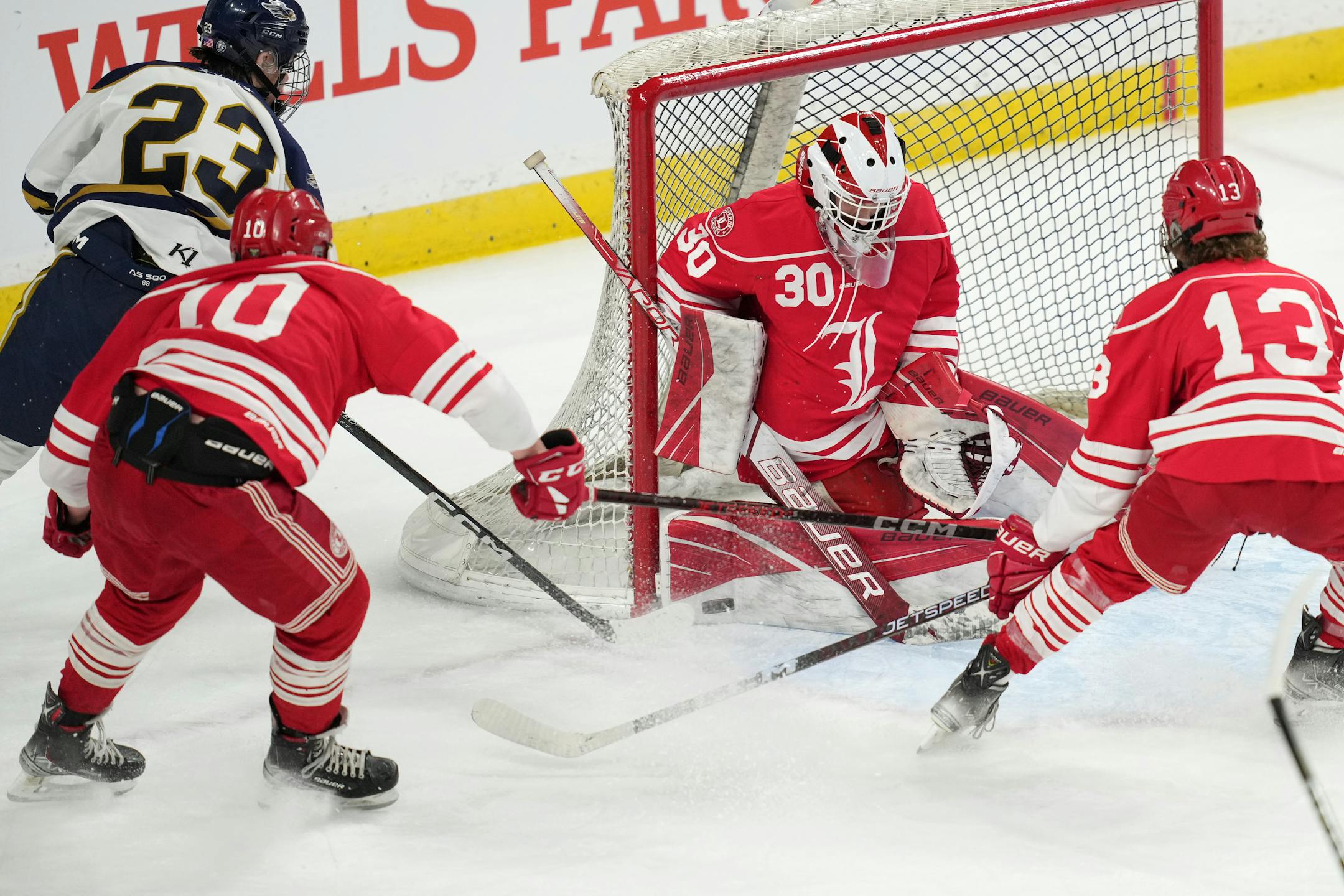 Hermantown forward River Freeman (23) takes a shot on Luverne goaltender Tyler Arends (30) in the first period of a MSHSL Class 1A quarterfinal hockey game between Luverne and Hermantown.
