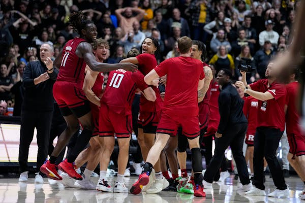 Rutgers players celebrates after defeated Purdue in 65-64 in an NCAA college basketball game in West Lafayette, Ind., Monday, Jan. 2, 2023. (AP Photo/