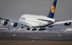 An Airbus A 380 of Lufthansa airline lands the airport in Frankfurt, Germany, Thursday, Feb. 14, 2019.