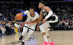 Grizzlies forward Ziaire Williams handled the ball against Bucks forward Giannis Antetokounmpo in the second half Thursday.