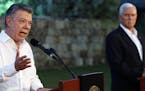 Colombian President Juan Manuel Santos, left, spoke to the media as U.S. Vice President Mike Pence listened during a joint news conference in Cartagen