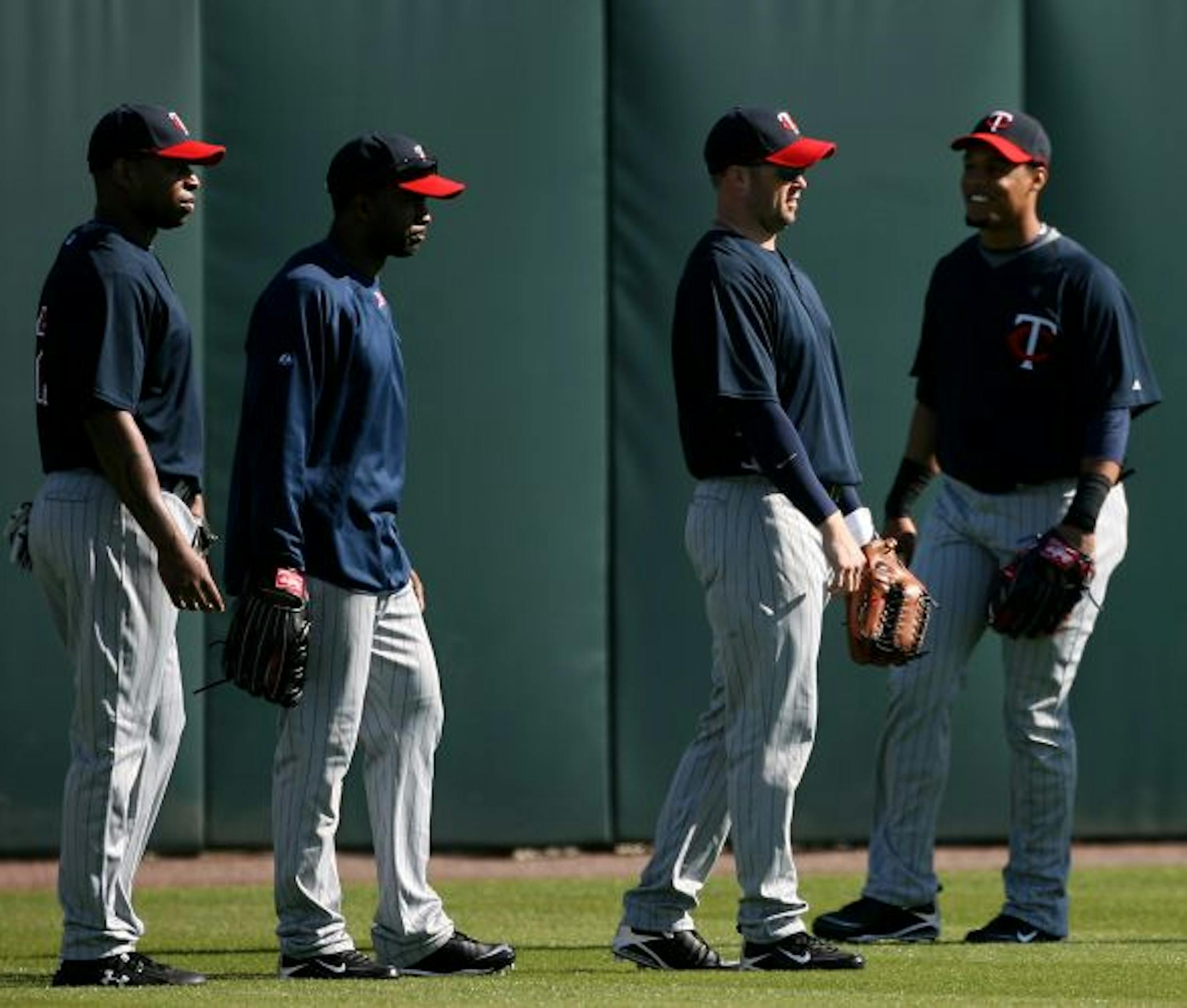 From left, Delmon Young, Denard Span, Michael Cuddyer and Carlos Gomez attended the first full-squad practice Saturday in Fort Myers.