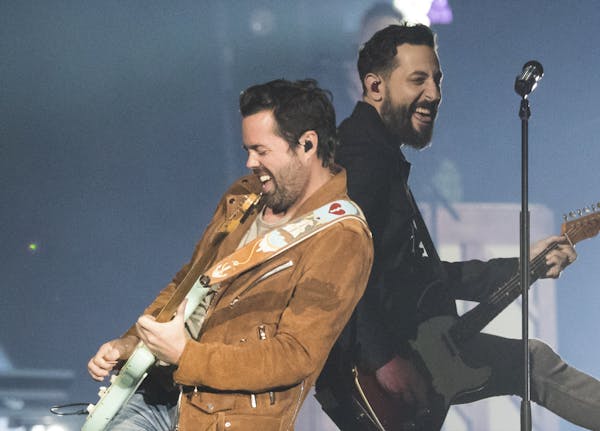 From the left; Old Dominion band members Brad Tursi, guitar, and Matthew Ramsey, guitar and vocals performed with the band at the Xcel Energy Center o
